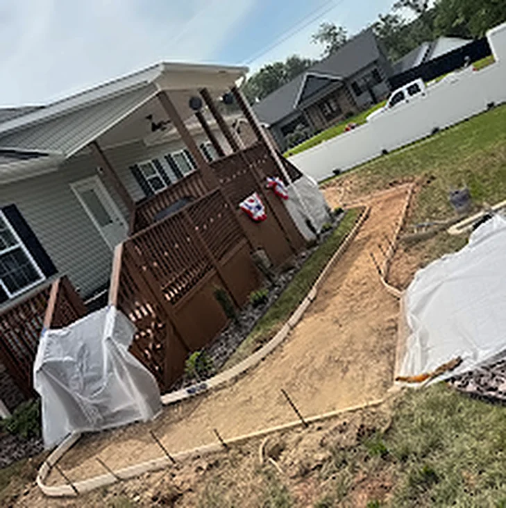 A walkway formed and prepped beside a house, ready for the pour